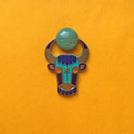 Enzu enamel bull or taurus pin in antique gold, with green agate cabochon between its horns.