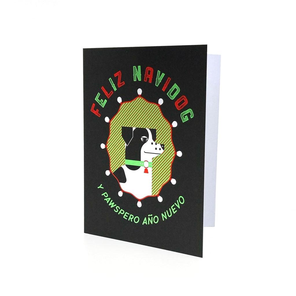 Feliz Navidog greeting card in black, green and red. Depicts a dog surrounded by festive lights.