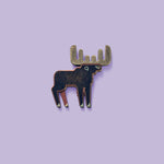Moose pin with antique copper and bronze finish on a purple background
