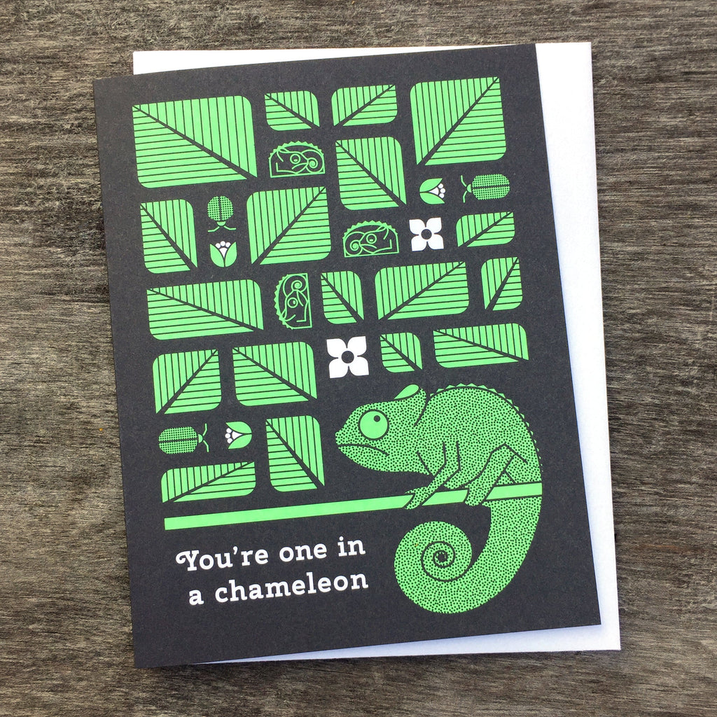 You're One In A Chameleon greeting card in green and black with eponymous text.