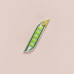 Green peas in a pod on a beige background