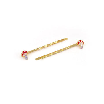 Amanita enamel mushroom hairpins in red with gold arms.