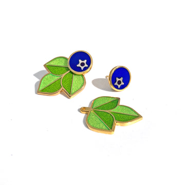 Blueberry enamel studs in gold with silver blossom end and two tone green leaf jackets in gold.