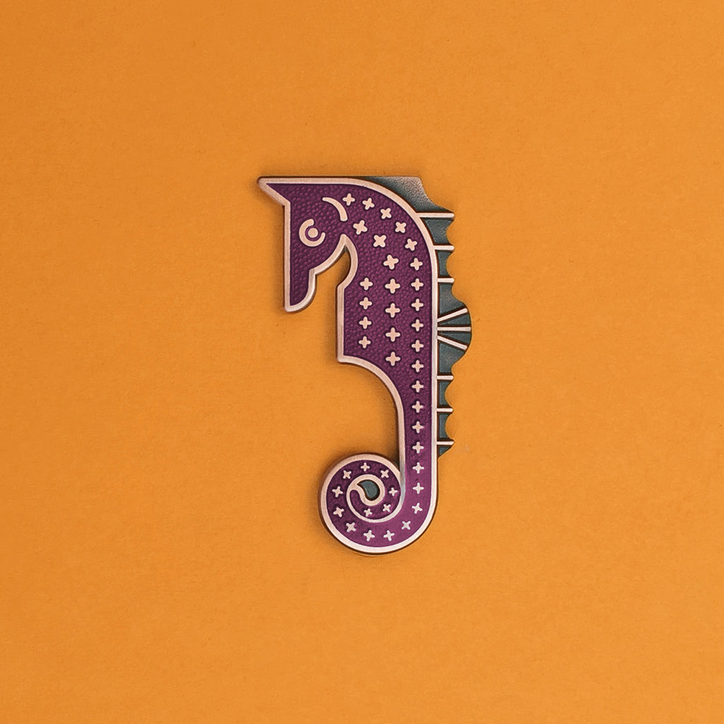 Calypso enamel seahorse pin in copper and lilac purple.