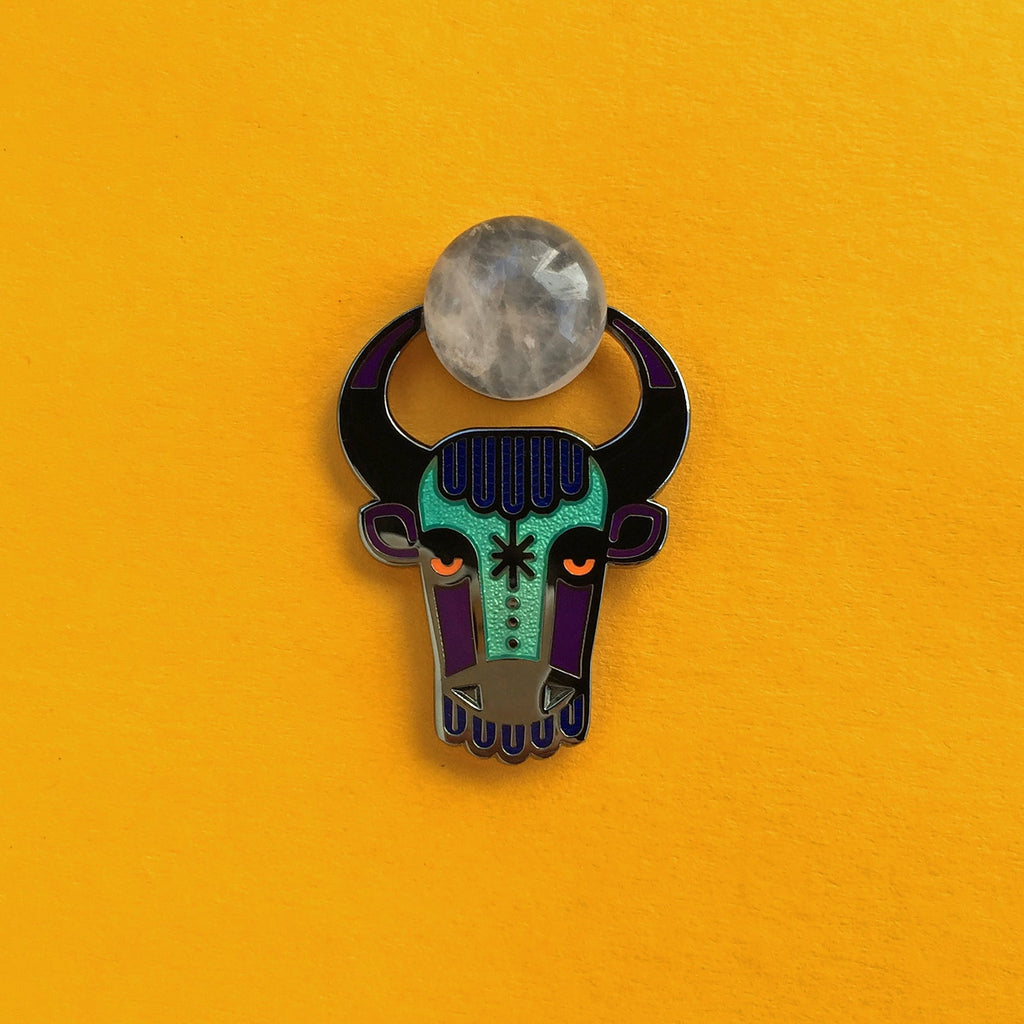 Enzu enamel bull or taurus pin seconds in antique gold, with green agate cabochon between its horns.