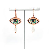 Ersa eye jade blue enamel earrings seconds in gold and antique copper with a custom double rainbow moonstone teardrops.
