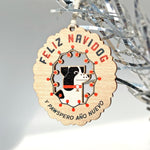 Laser woodcut Feliz Navidog holiday ornament showing a dog surrounded by festive lights in red, green and black.