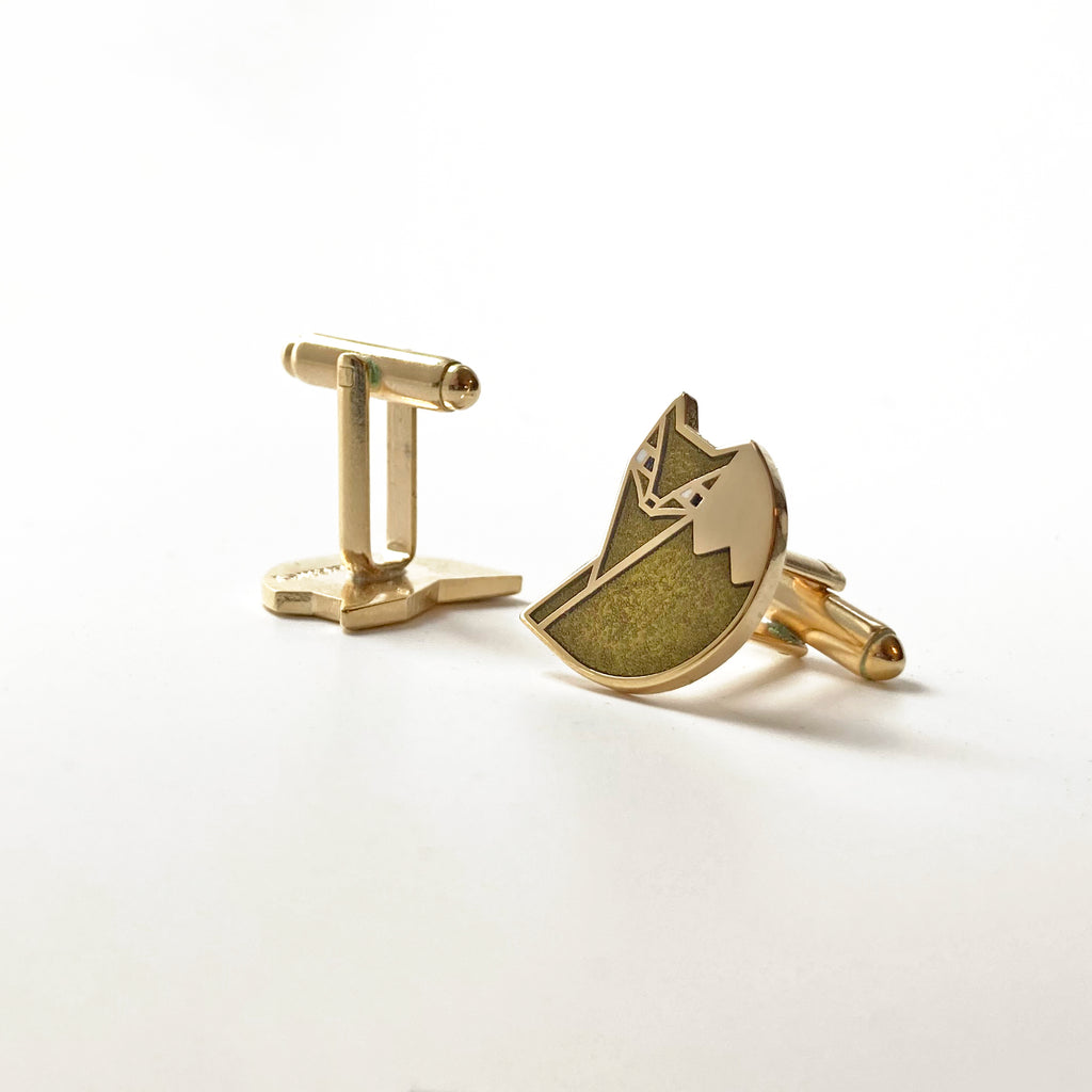 Reverse detail: Foxsimile light grey enamel sly fox cufflinks with 24k gold finish showing the bullet toggle back.