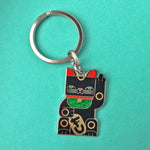 Goodbye Kitty black enamel maneki neko split-ring keychain finished in gold and black with green glitter bib.