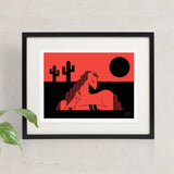 Foal Moon screen print framed and hung. Depicts a horse and foal enjoying a desert sunset behind saguaro cactus.