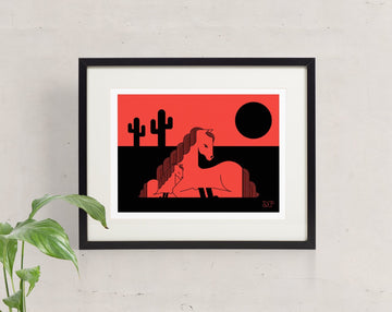 Foal Moon screen print framed and hung. Depicts a horse and foal enjoying a desert sunset behind saguaro cactus.