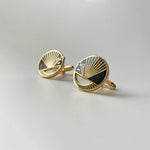 Karmadillo black enamel armadillo cufflinks finished in 24k gold with bullet toggle backs.