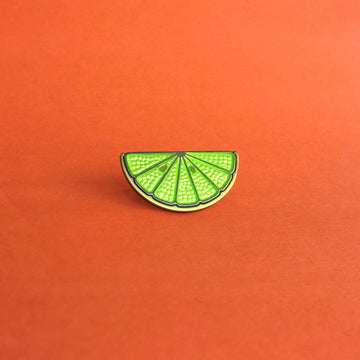 Key Lime green enamel lime slice pin finished in antique gold and silver.