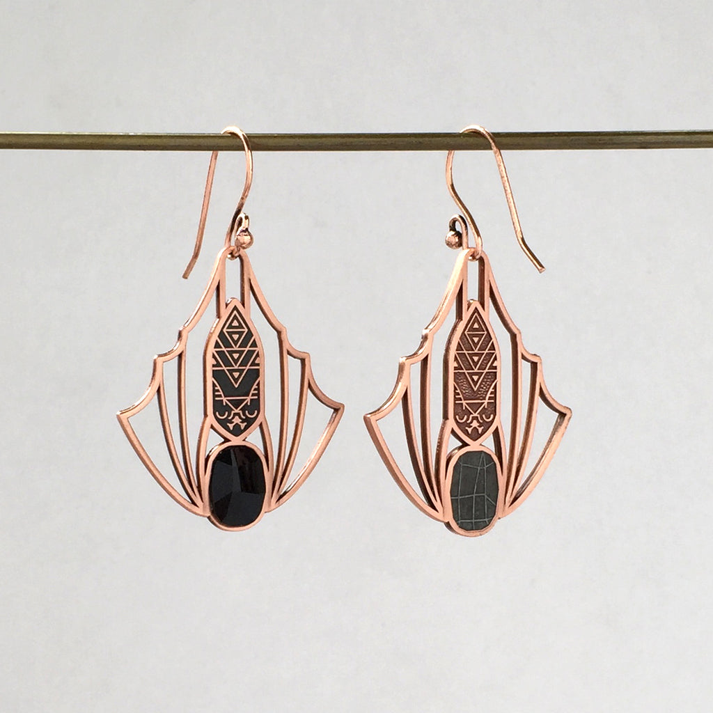 Reverse detail of Minyades bat earrings showing the mirrored back relief design and siofourite crystal setting.