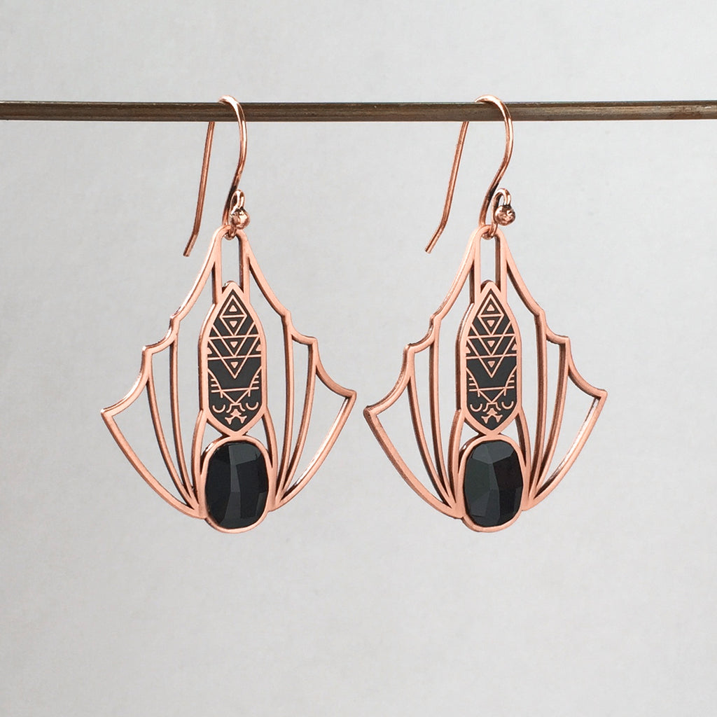 Minyades bat earrings in antique copper, with wirework style wings, black enamel body and black faceted siofourite crystals.