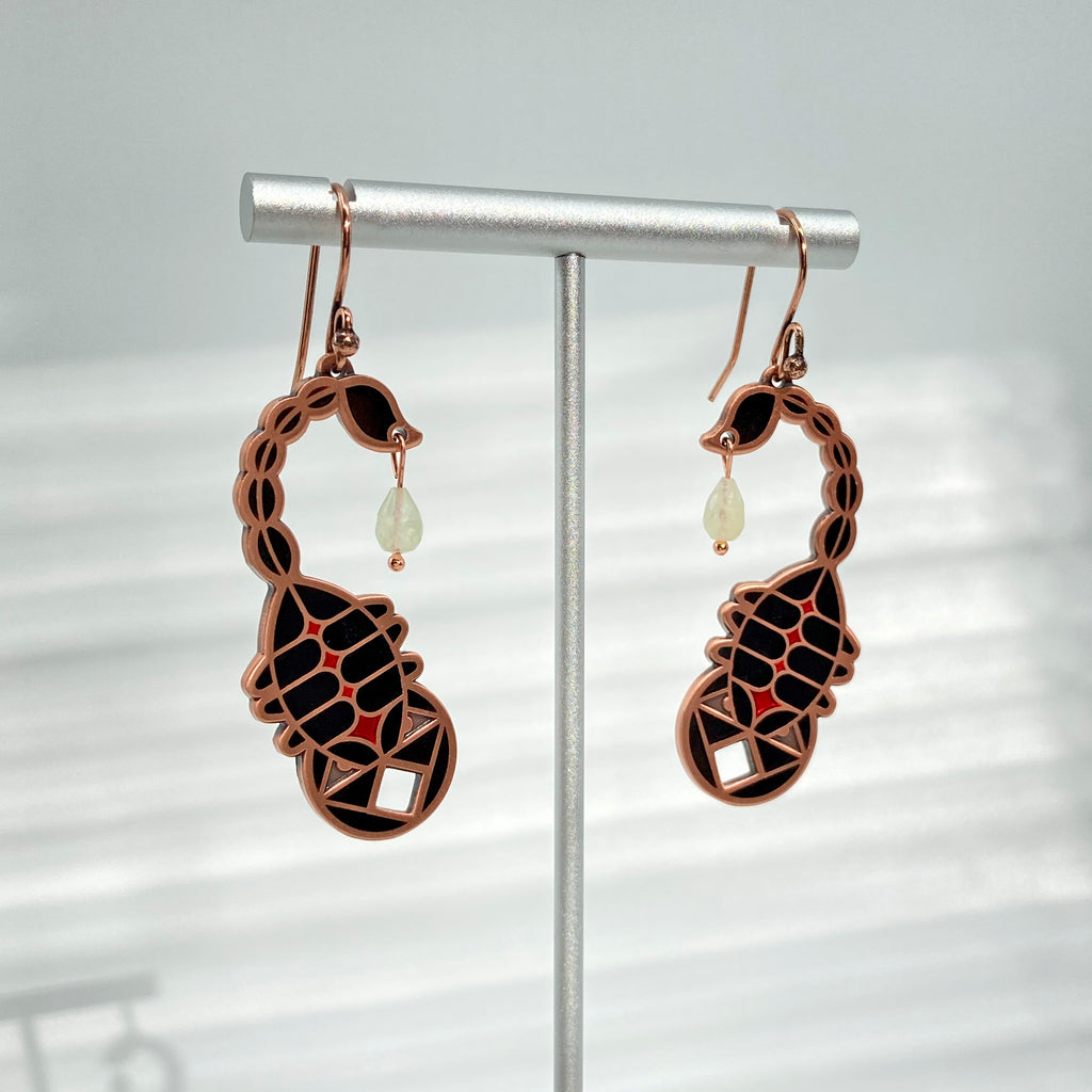 Ishara black enamel scorpion earrings in antique copper with prehnite teardrop poison dangle and copper hooks.