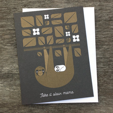 Take It Slow, Mama greeting card in brown and black. Shows a sloth with her cub hanging from a tree branch with leaves.
