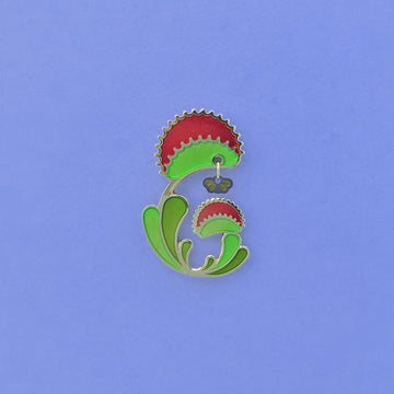 Venus Flytrap enamel pin. Dionaea muscipula in green, red and 24k gold finish. Fly dangle in silver and translucent wings.