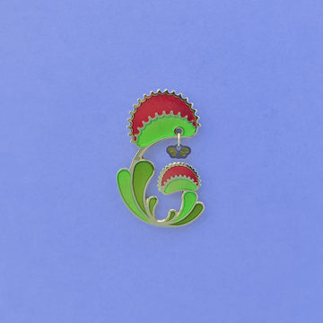 Venus Flytrap enamel pin. Dionaea muscipula in green, red and 24k gold finish. Fly dangle in silver and translucent wings.